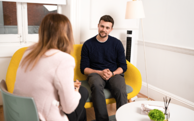 sam and joann talking in a therapy room for blog