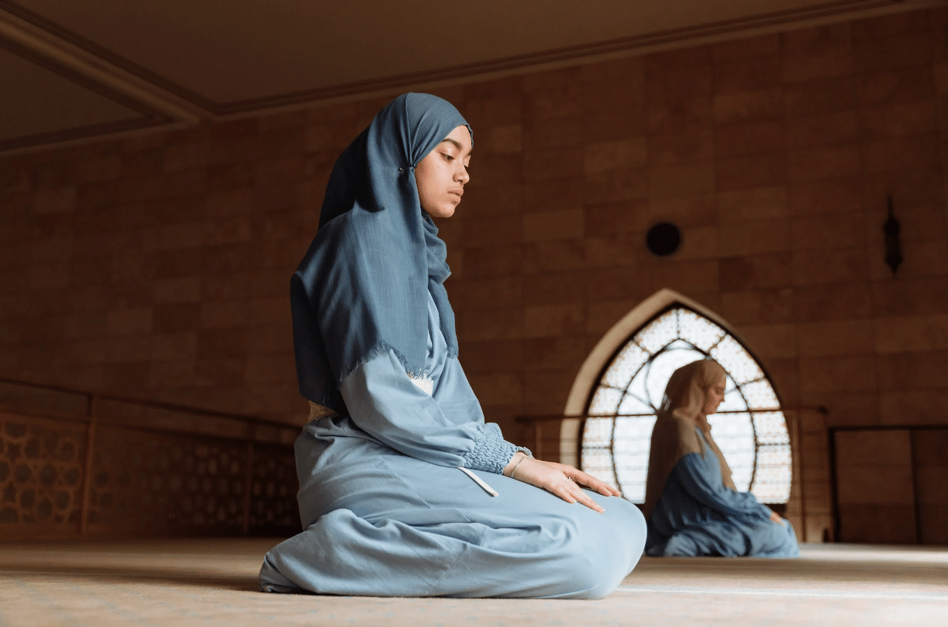 young women in prayer in a mosque for ramadan