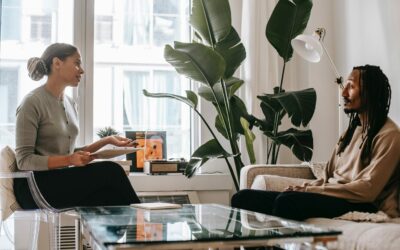An individual eating disorder therapy session taking place between a female eating disorder therapist and a male patient.