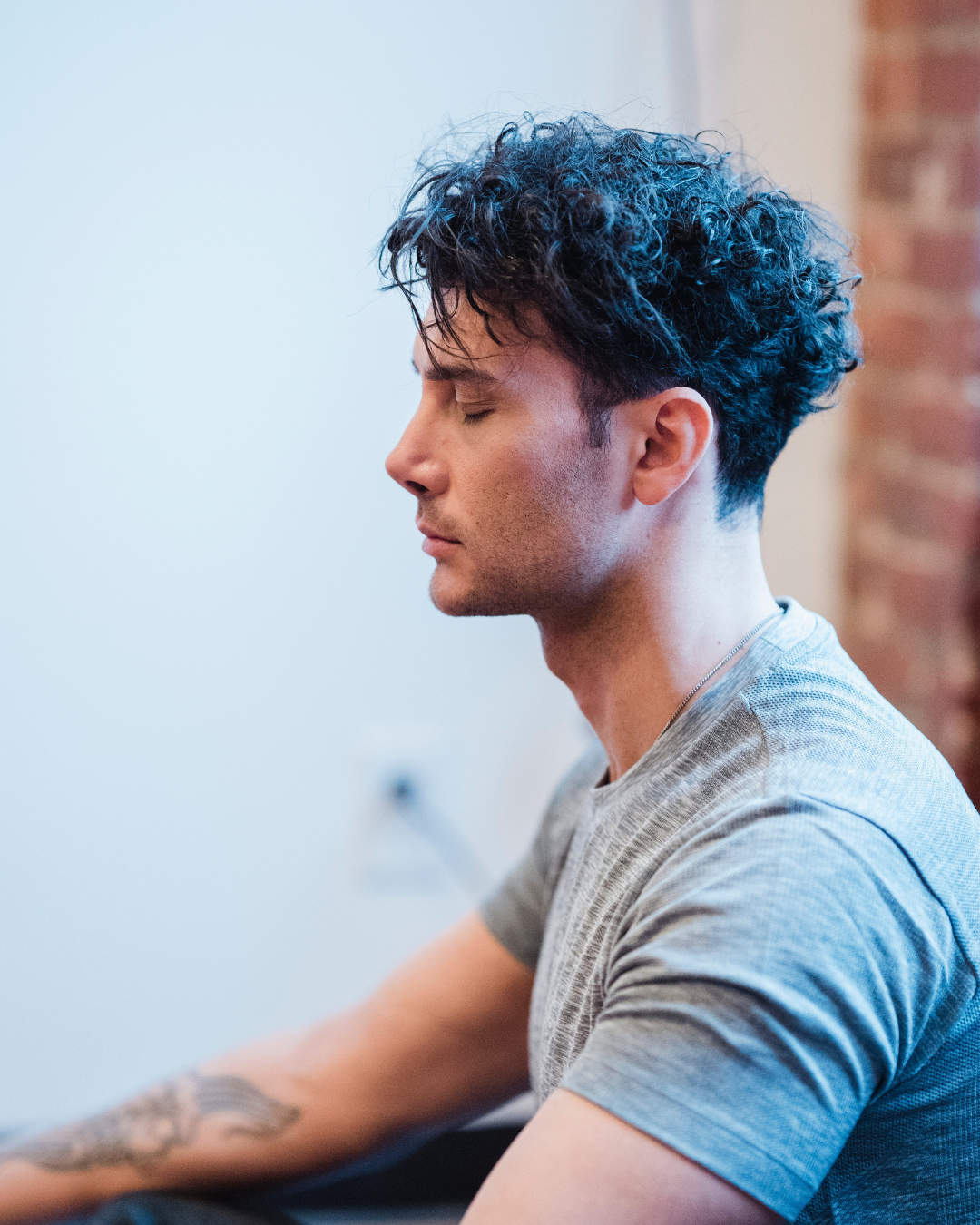 woman with short hair reading a book