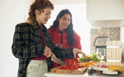 Two people preparing food together