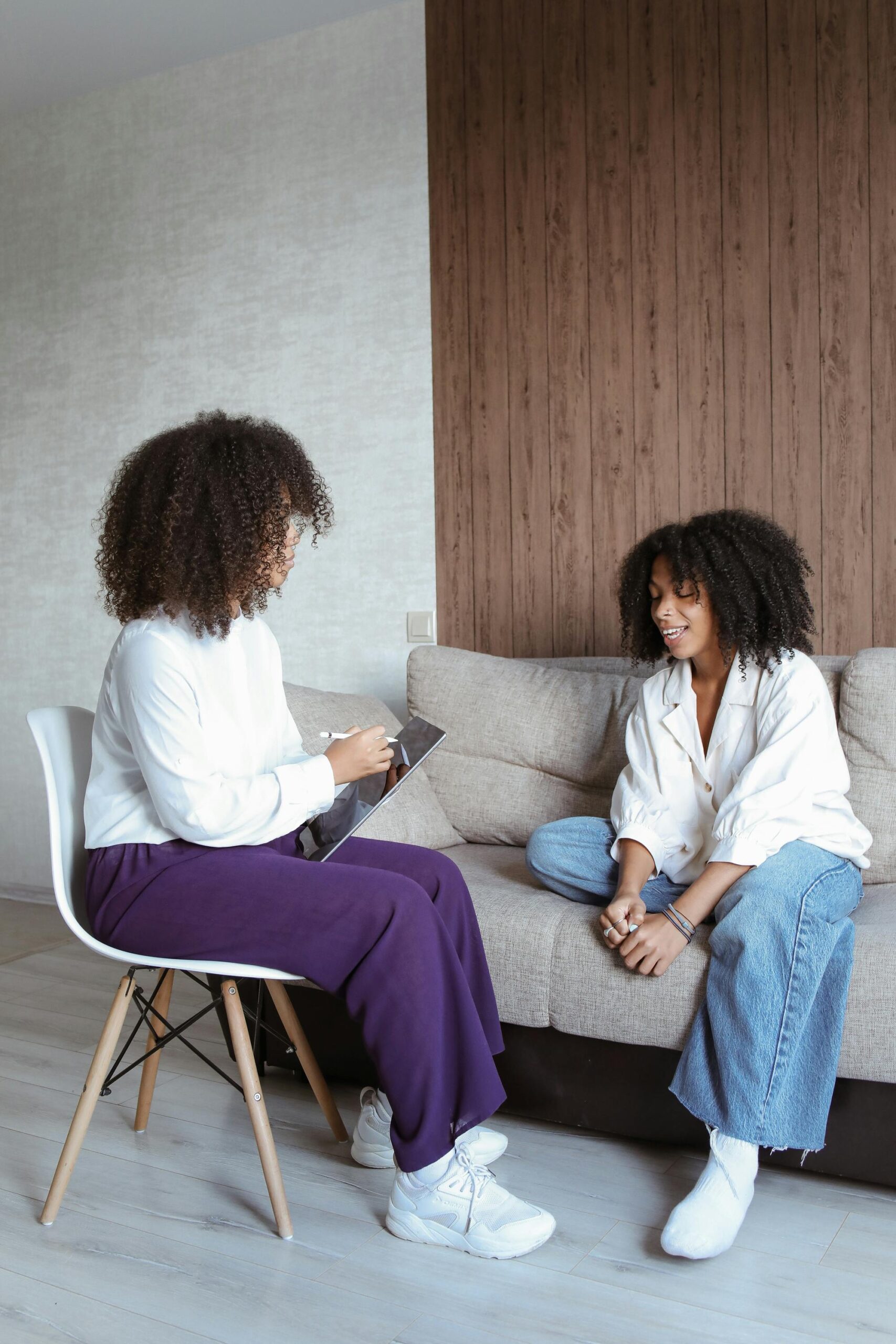 A professional therapist sits opposite a patient and conducts a session on Understanding Eating Disorders for Eating Disorders Awareness Week 2025